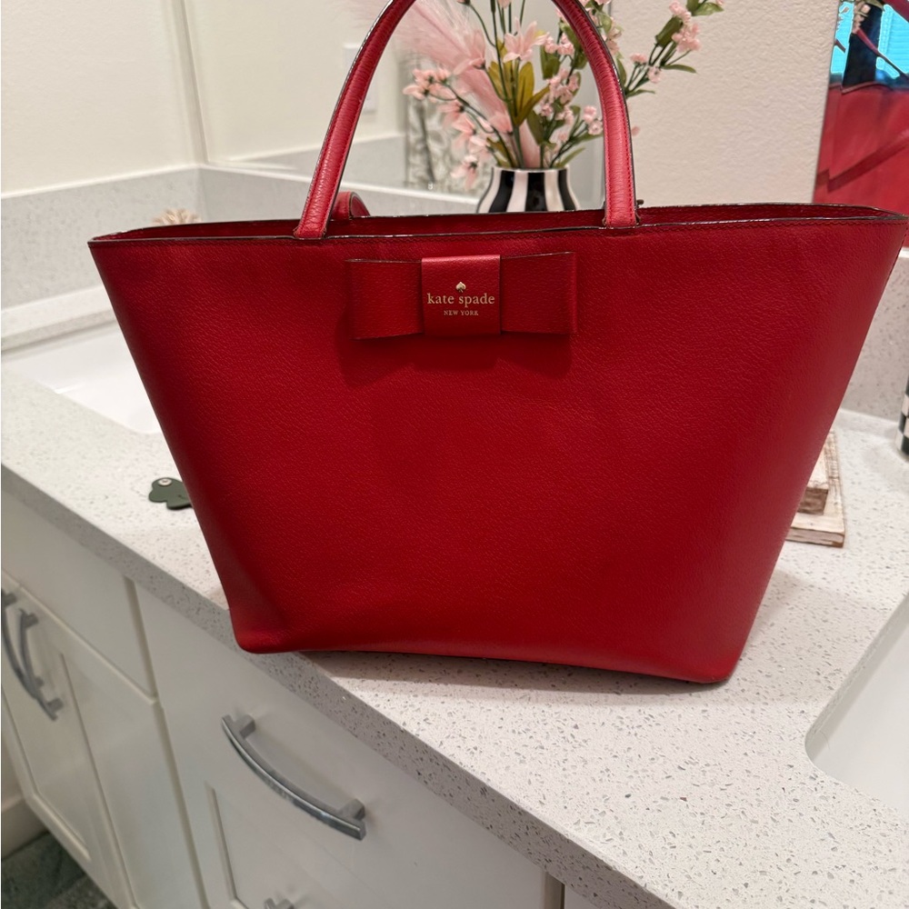 kate spade red leather tote with signature bow detail